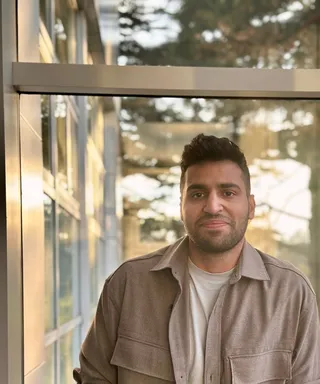 Usama Shahid, smiling in warm evening light